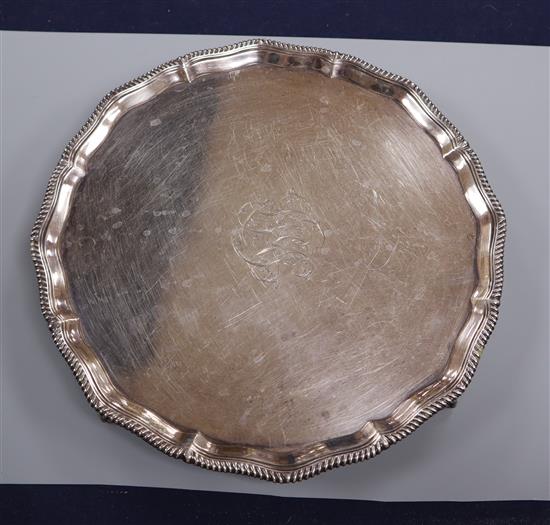 A Victorian silver salver with gadrooned edge, monogrammed, London 1894, makers Goldsmiths & Silversmiths Co. 18 oz.